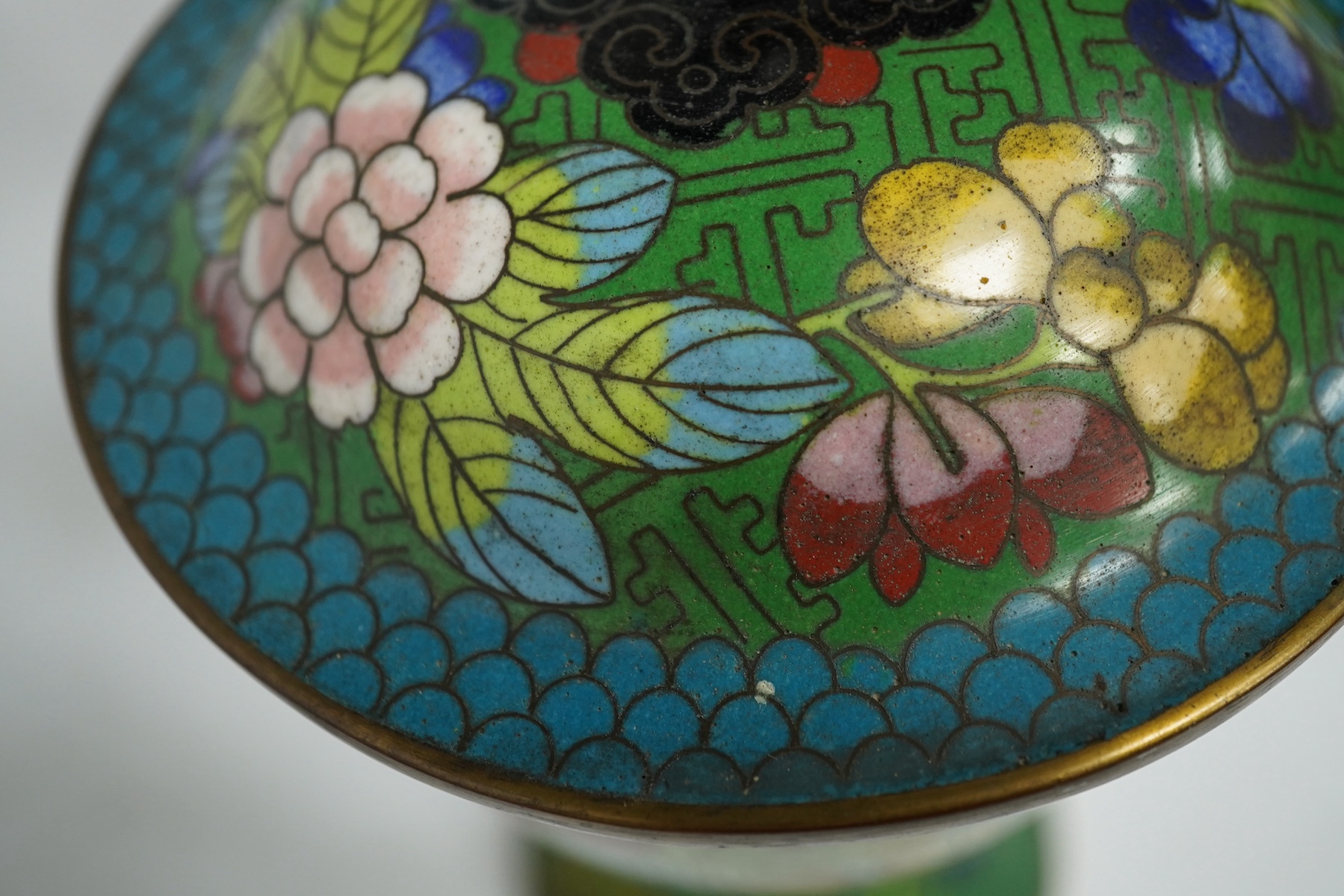 A pair of Chinese champleve enamel floral jars and covers, 22cm high. Condition - good